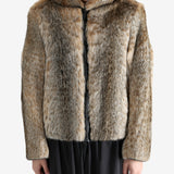 Tan jacket worn by a person, showing the jacket fit