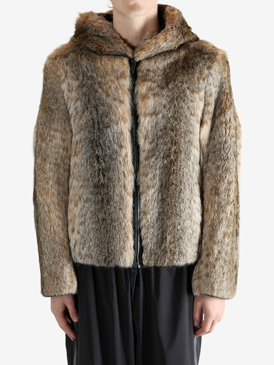 Tan jacket worn by a person, showing the jacket fit