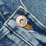 Close up of blue jeans, showing texture of the cotton fabric