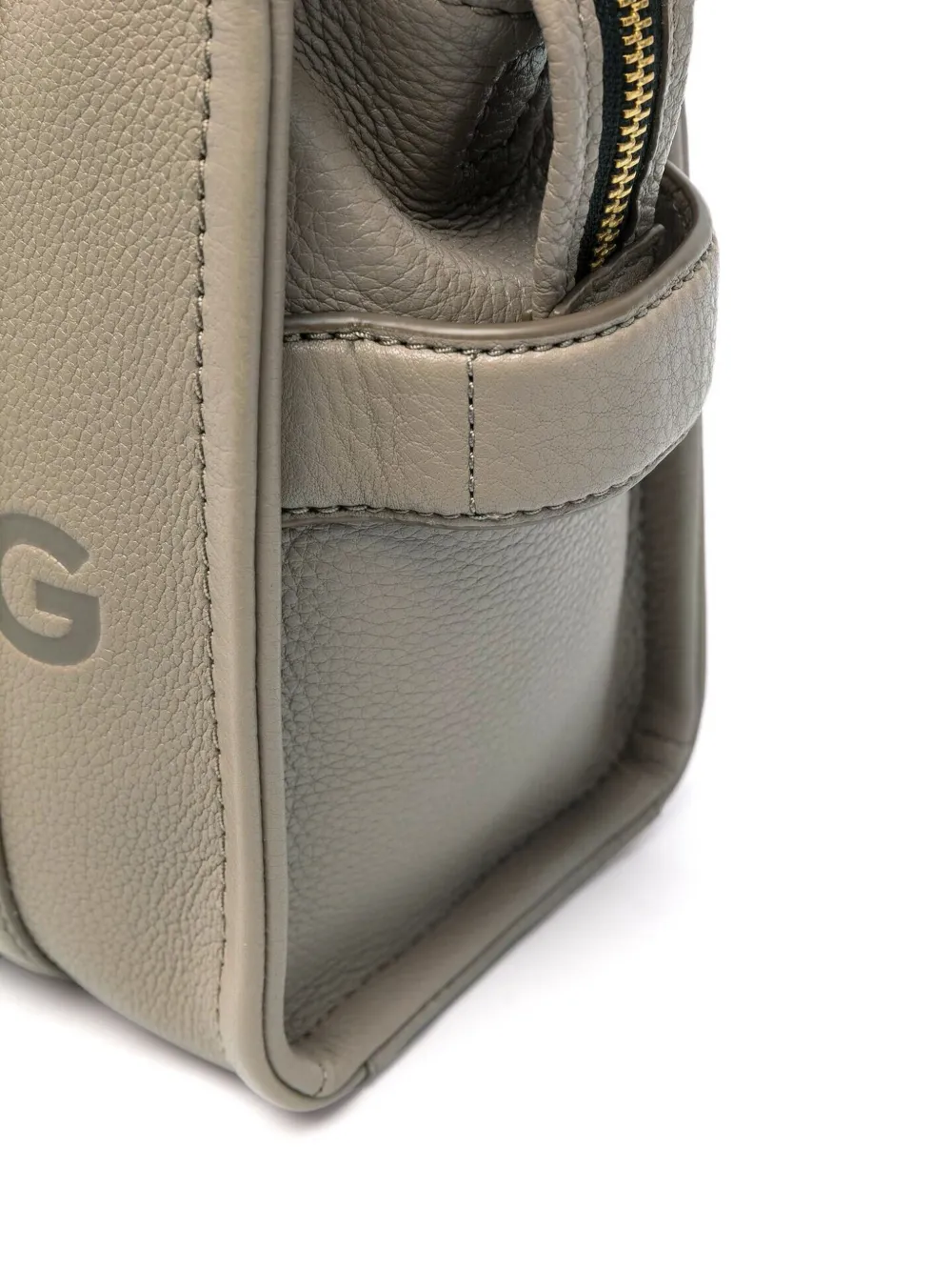 Close up of tan bag, showing texture of the calf leather fabric