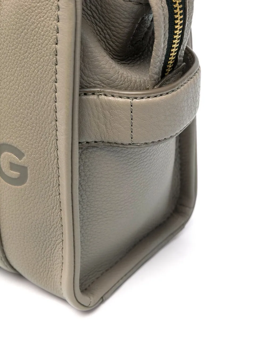 Close up of tan bag, showing texture of the calf leather fabric