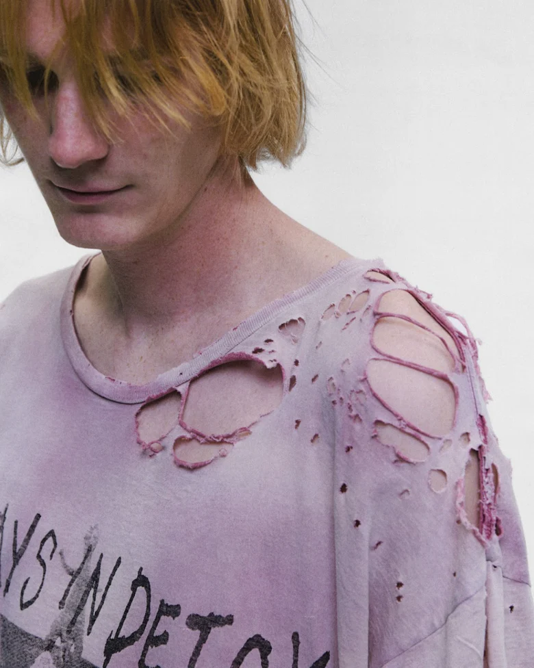 Purple t-shirt worn by a person, showing the t-shirt fit