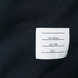 Close up of navy hoodies, showing texture of the cotton fabric