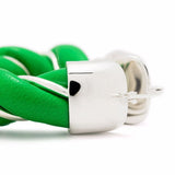 Close up of green eartrings, showing texture of the sliver fabric