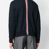 Navy hoodies worn by a person, showing the hoodies fit