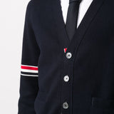 Close up of navy cardigan,showing texture of the cotton fabric.