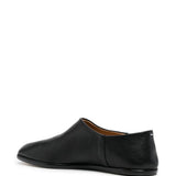 black flats, back view