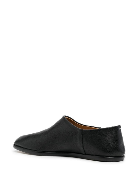 black flats, back view